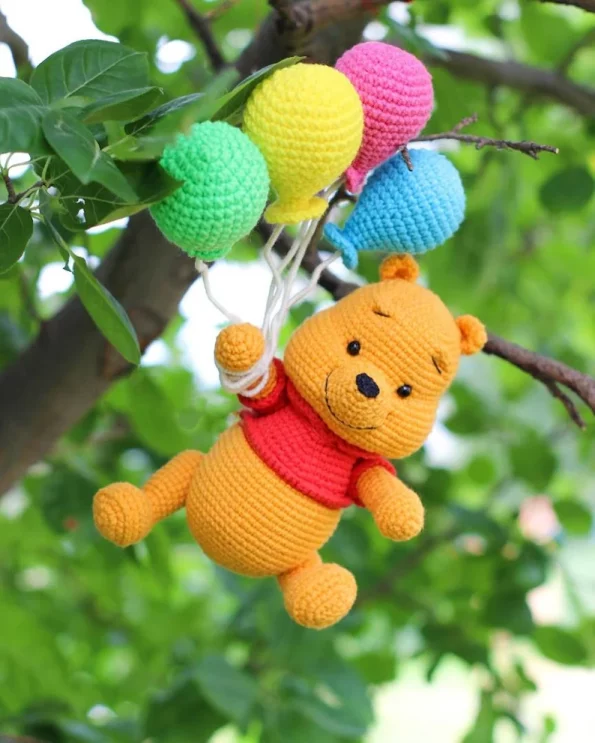 Crochet Pattern for a Teddy Bear Holding a Balloon